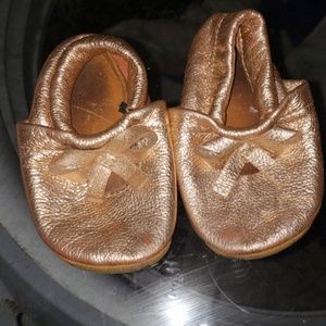 Gold moccasins size 6 toddler